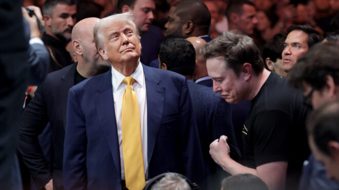 MIAMI, FLORIDA - APRIL 12: U.S. President Donald Trump prepares to watch the Ultimate Fighting Championship with Elon Musk at the Kaseya Center on April 12, 2025 in Miami, Florida. The Trump administration issued a rule late Friday that spared smartphones, computers, semiconductors, and other electronics from some of the tariffs they have enacted. (Photo by Joe Raedle/Getty Images)